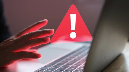 Businessman man hands are bored when using notebook to work then there is lost device alert or red computer virus.