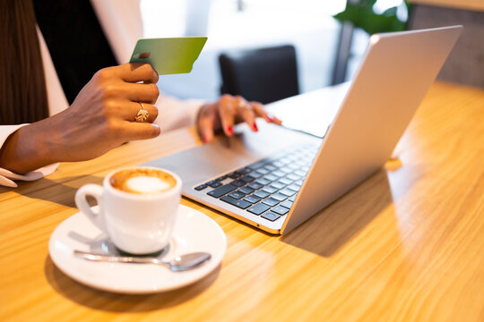Unrecognizable woman doing online purchase