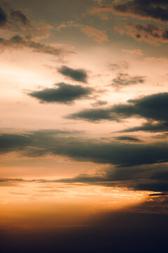 Beautiful view of the evening orange sky with black clouds