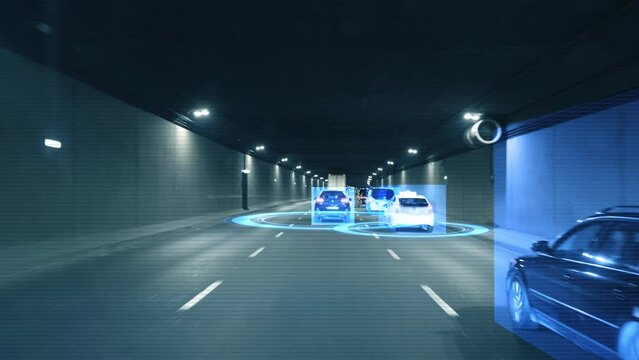 Inside view a moving autonomous self-driving car vith HUD elements driving through a tunnel, scanning the surrounding cars and road with a sensor. Concept of the smart transort of the future. 4k 