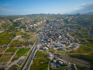 Goreme town aerial view at Goreme Historic National Park in Cappadocia, Central Anatolia, Nevsehir Province, Turkey. Goreme Historic National Park is a UNESCO World Heritage Site since 1985. 