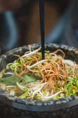 Bun Bo Hue, Bun Bo, Vietnamese beef noodle soup spicy in stone bowl