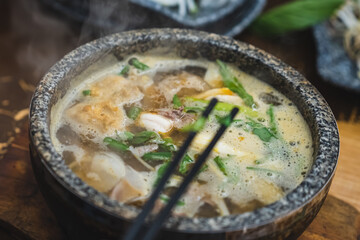 Bun Bo Hue, Bun Bo, Vietnamese beef noodle soup spicy in stone bowl