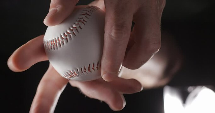 Baseball ball in studio close-up, macro, with smoke 4K, vertical slow-motion 