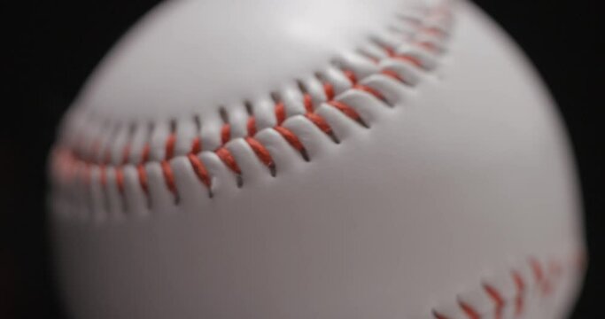Baseball ball in studio close-up, macro, with smoke 4K, slow-motion