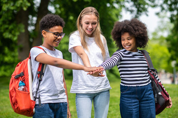 Volunteer spending time with kids and all looking happy
