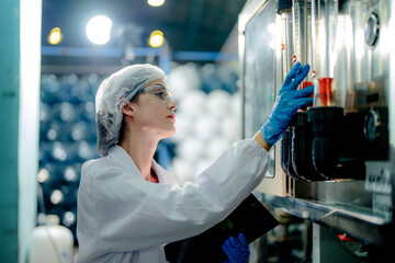 scientist worker checking the quality of Reverse osmosis machine system at the industrial factory....