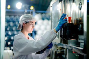 scientist worker checking the quality of Reverse osmosis machine system at the industrial factory....