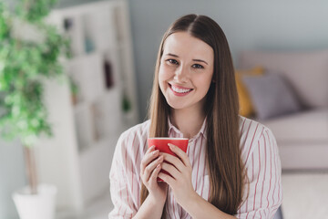 Photo portrait of pretty young girl hold coffee mug relax dressed stylish smart casual outfit interior modern furniture loft room office