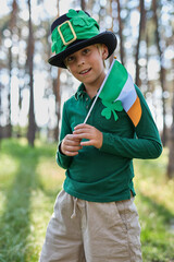 Funny little boy dressed as a leprechaun for a St. Patrick's Day on the 17th of March