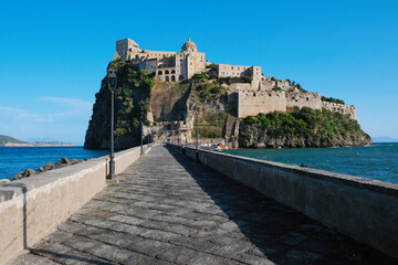 Aragonese Castle seen from the bridge to Ischia Island, at the northern end of the Gulf of Naples, Italy. - obrazy, fototapety, plakaty