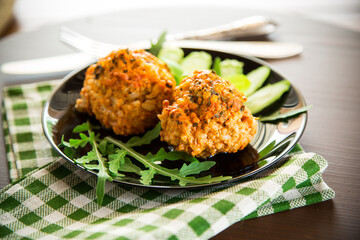 Cooked meatballs in a plate with fresh vegetables