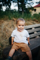 Fototapeta premium child sitting on a bench