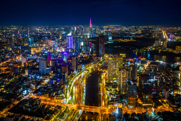 Naklejka na ściany i meble Aerial view of Ho chi minh city or Saigon city at night in Vietnam.