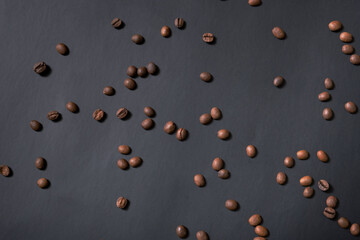 Coffee beans on black background top view