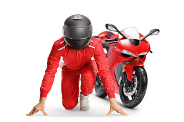 Motorbike racer in a set position preparing for a run
