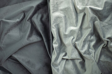 gray velvet with folds, dark and light textile, luxury silk fabric background and copy space