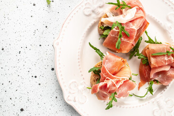 Jamon Iberico with white bread. banner, menu, recipe place for text, top view