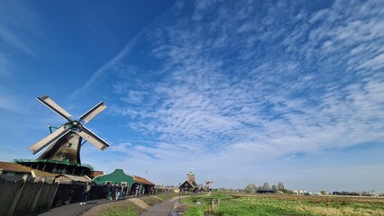 Zaanse Schans, April 22, 2023: Netherlands rural lanscape Windmills at famous tourist site. park...