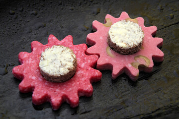 The concept of fast food delivery. Imitation of gears made from hard cheese, salami sausage, bread...