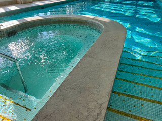 View of luxury swimming pool with clear water indoors