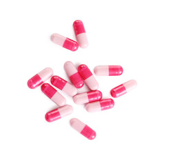 Many pink pills isolated on white, top view