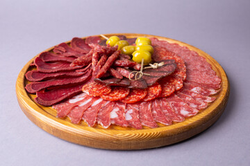 meat sliced from delicacies on a wooden stand