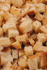 Croutons. Roasted white bread. Close-up of delicious croutons. Macro shot of croutons.