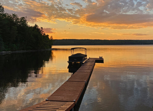 Dock at sunset with boat