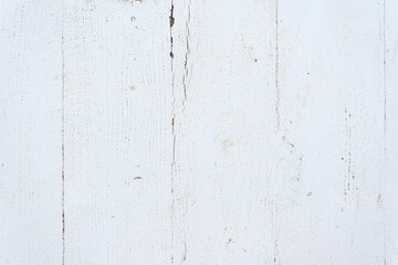 Texture of a white floor with dirt and cracks in the paint.