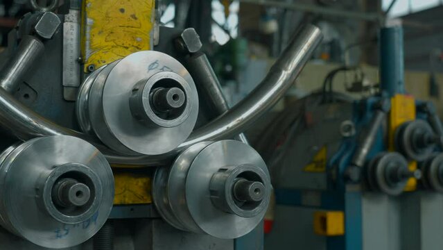 Industrial bender equipment machine for metal pipe bending in the factory. Creative. Automatic metalworking machine.