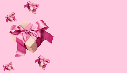 Wide web site banner with gift boxes flying on pink background. Holiday banner, copy space.