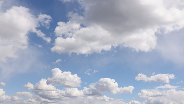 Bright white clouds over blue sky