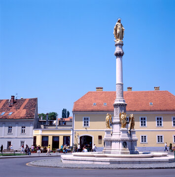 Golden statue with angels on the Kaptol square, Zagreb, Croatia