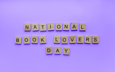 August 9, Book Lovers Day, minimalistic banner, inscription in wooden letters national Book Lovers Day