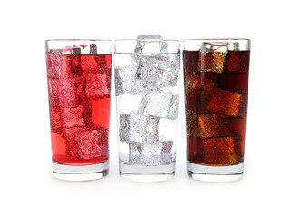 Glasses of different refreshing soda water with ice cubes isolated on white