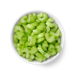 Bowl of fresh cut celery isolated on white, top view