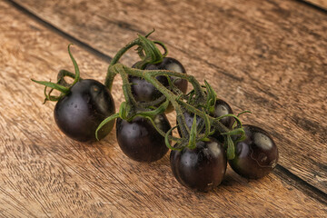 Ripe tasty black cherry tomato