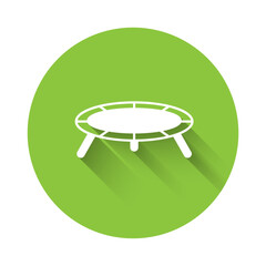 White Jumping trampoline icon isolated with long shadow background. Green circle button. Vector