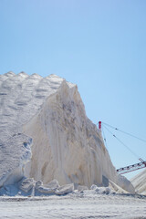 Large piles of what looks to be salt at an industrial factory in California. 