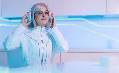 Woman in futuristic costume. Female in modern VR glasses interacting with network while having...