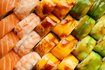 Set of various sushi rolls, top view, close-up.