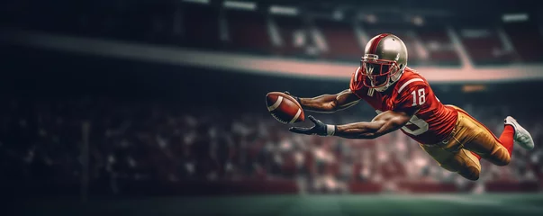 Fotobehang An American football player catches the ball in a beautiful jump. The background is a football arena. Copy space © Semper Fidelis