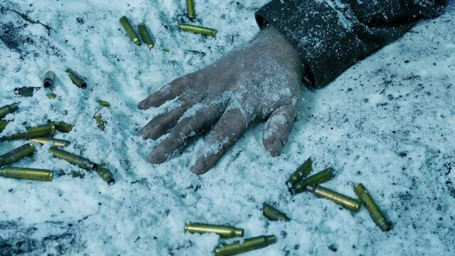 Arm Of Dead Soldier On Snowy Battlefield
