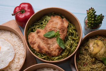 Green sauce pesto pasta with chicken fillet Food buffet peruvian table Assorted dishes gourmet cuisine Peru traditional 
