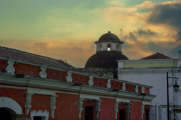 Dome in colonial house in Antigua Guatemala, exterior architectural detail with dramatic sunset.