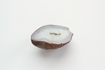 Natural violet amethyst druse geode mineral crystal polished semi-precious gemstone on purple...