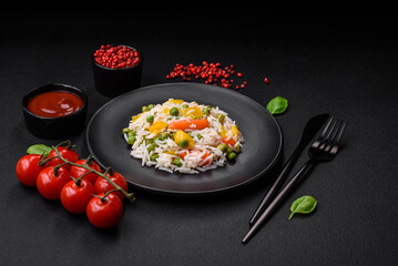 Delicious fresh white boiled rice with vegetables carrots, peppers and asparagus beans on a ceramic plate