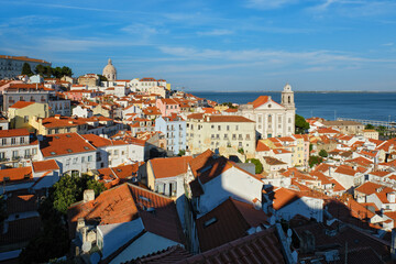 View of Lisbon famous postcard iconic view from Miradouro de Santa Luzia tourist viewpoint over Alfama old city district. Lisbon, Portugal.