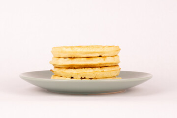 Side view stack of waffles on plate
